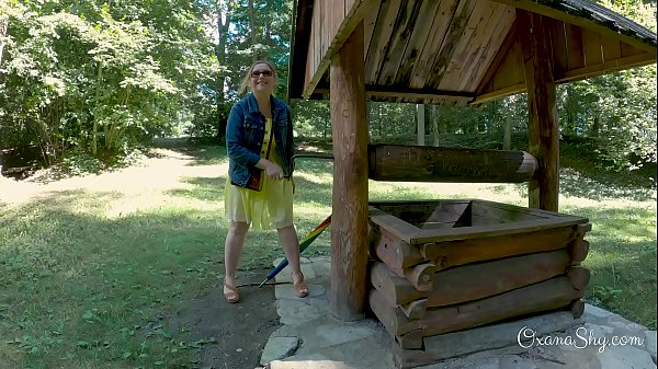 Buttpluged slut in a nature park